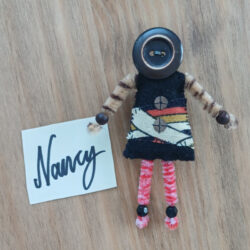Doll brooch